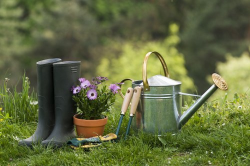 Garden maintenance team sorting green waste for licensed disposal